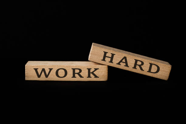 istock Wooden blocks with the words work hard 1283908575