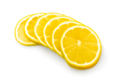 Lemon fruits and lemon slice with green leaves. File contains clipping path.