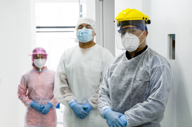 istock A group of doctors in protective suit against the virus. 1283909562