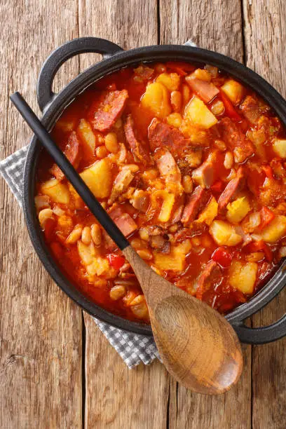 Photo of Locro is a thick and nourishing stew which originated in South America close-up in a pot. vertical top view