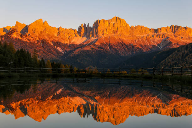 Rosengarten mountain range lake reflection What a view of Rosengarten mountain range in the Dolomites, Italy. catinaccio stock pictures, royalty-free photos & images