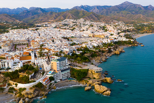 Scenic aerial view of Spanish tourist city of Nerja on southern Mediterranean coast in sunny autumn day, province of Malaga