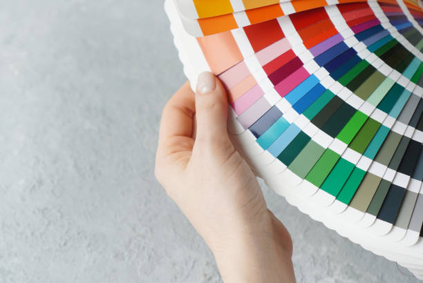 istock Colour catalogue for interior design in female hands 1283915643