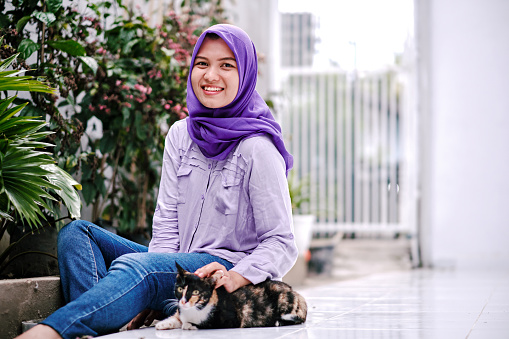 Muslim woman and pet