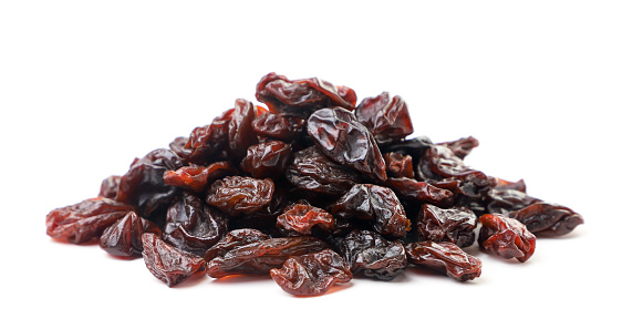 Heap of raisins close-up on a white background. Isolated