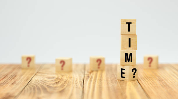 istock cubes with message TIME? on wooden surface - 3d illustration 1283917858