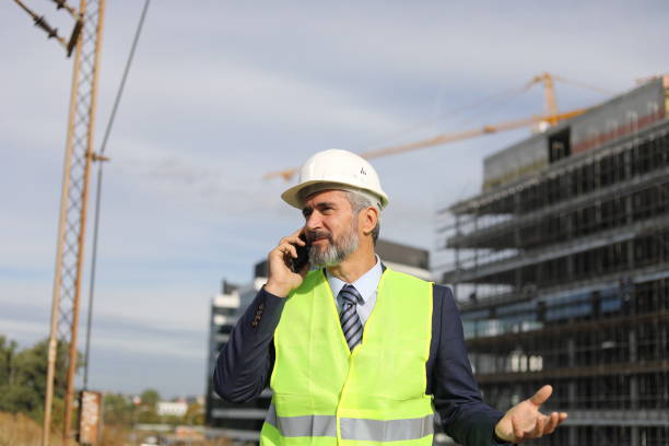istock Senior businessman architect helmet construction site building architecture 1283919295