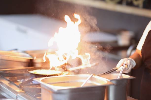 istock Cook prepares food on fire 1283919473