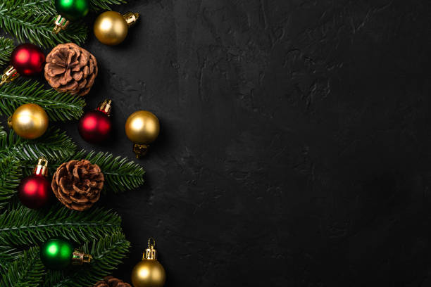 istock Christmas composition. Colorful ornament, pine cones and fir needles decorations on dark background. Top view copy space 1283920593