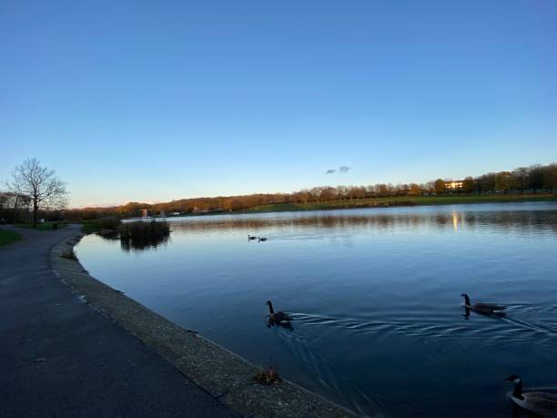 istock Sunset sky over the lake with some clouds at the horizon 1283921591
