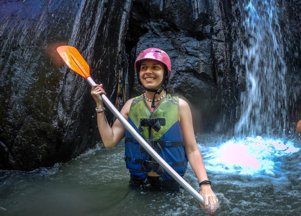istock Passengers on Rafting Boat Traveling Down River 1283922081