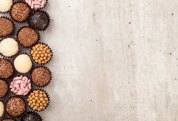 Typical brazilian brigadeiros, various flavors with room for text.