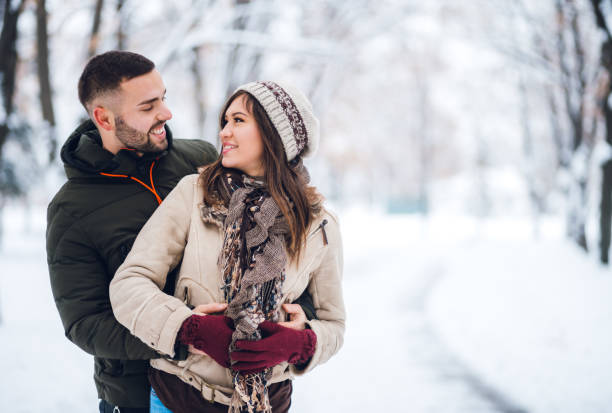 istock Young couple in the snow 1283925243
