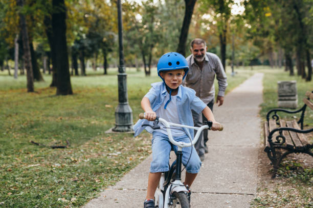 istock boy with his grandfather in public park 1283926689