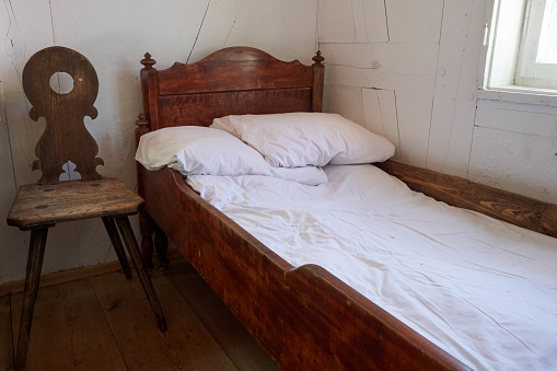 OLd chamber with old wooden bed.