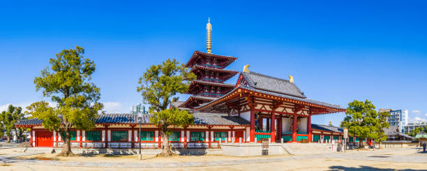 Osaka Shitennoji Temple and towering Five Storey Pagoda panorama Japan The ornate five storey pagoda overlooking the entrance to Shitennoji Temple in the heart of Osaka, Japan’s vibrant second city. shitenno ji stock pictures, royalty-free photos & images