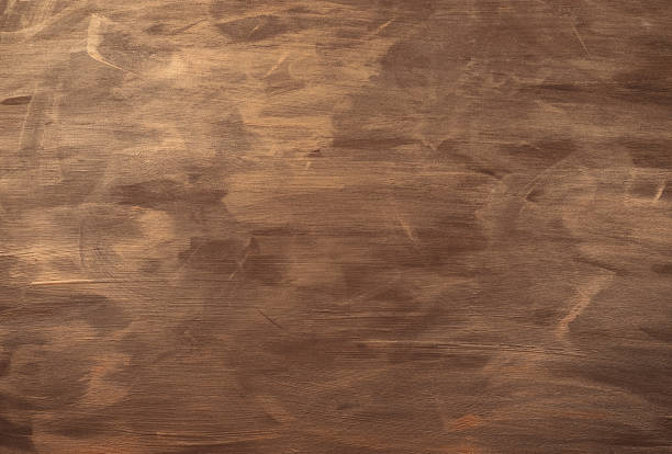 Wooden board painted with gold paint. Background and texture.