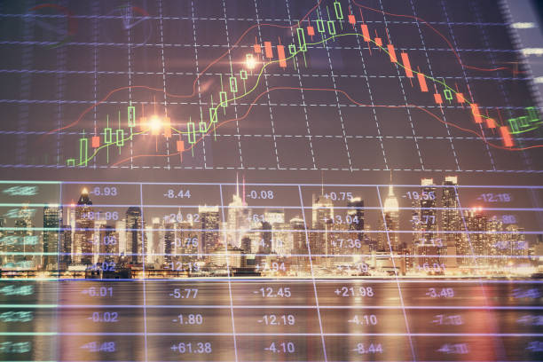 istock Financial graph on night city scape with tall buildings background multi exposure. Analysis concept. 1283930797