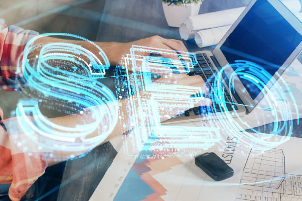 istock Multi exposure of seo icon with man working on computer on background. Concept of search engine optimization. 1283931534