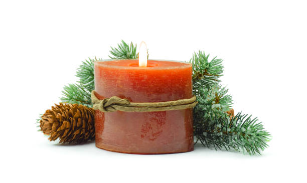 istock New Year's decor. Christmas composition: spruce branches with a candle and tinsel. Isolated on white. Copyspace. 1283931684