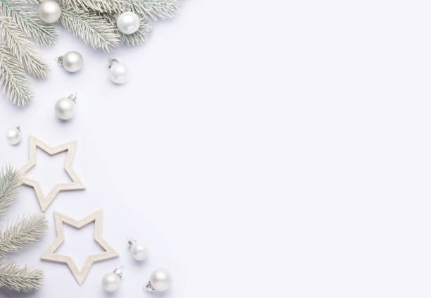 istock Light composition with white christmas balls and spruce branches. 1283931738