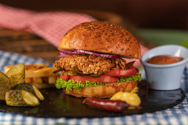 Homemade fried chicken burger Homemade fried chicken burger with pickles crunchy stock pictures, royalty-free photos & images