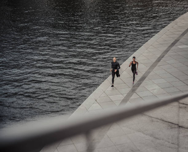 istock Couple running near the river 1283938160