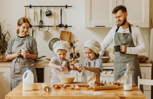 istock Positive family preparing pastry together 1283938588
