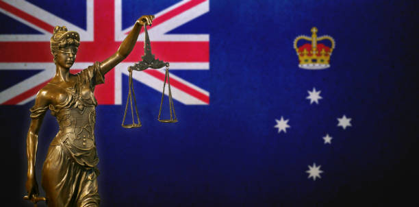 istock Lady Justice before a flag of Victoria 1283939321
