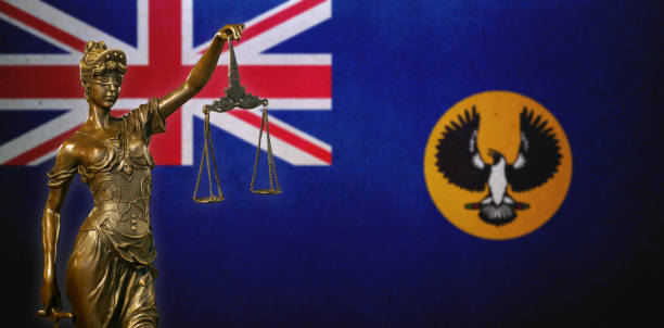 istock Lady Justice before a flag of South Australia 1283939326
