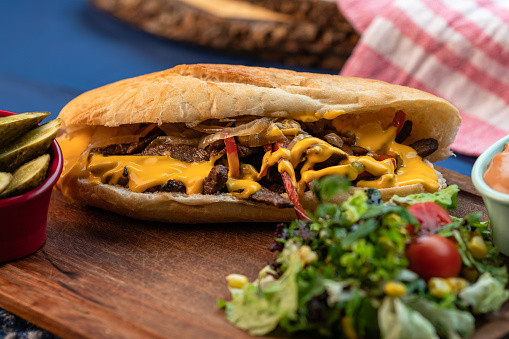 Beef steak sandwich with onions, mushroom and cheddar cheese