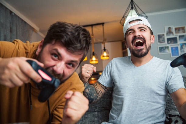 istock friends playing games and having fun at home 1283940830