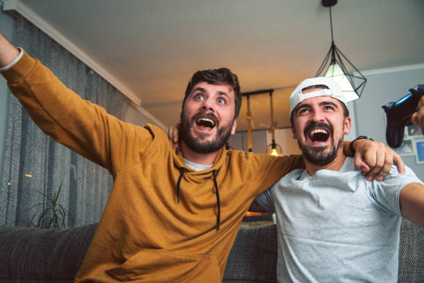 istock friends playing games and having fun at home 1283941568