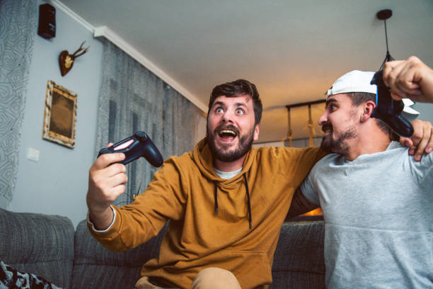 istock friends playing games and having fun at home 1283941597