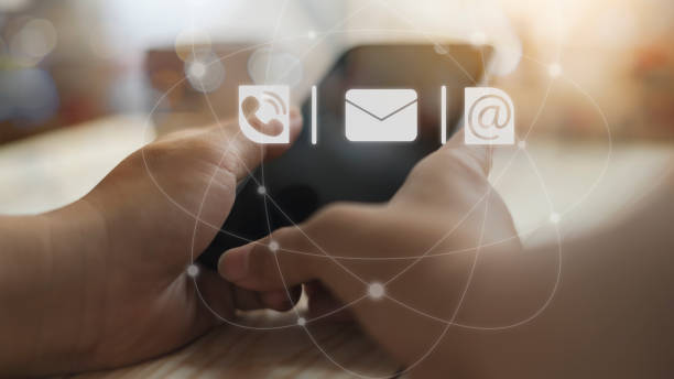 istock Hand of a woman using a smartphone with a customer contact icon support. 1283942640