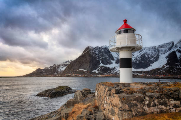 istock lighthouse in the foreground, at sunset on a cloudy day 1283943996
