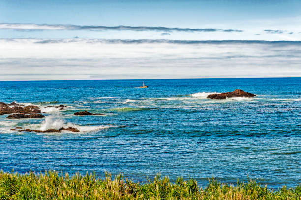 istock Half Moon Bay Shoreline Views and Small Boat 1283944201