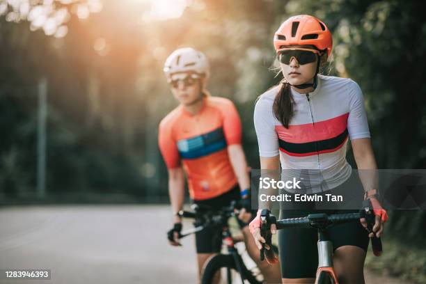 2 Asian Chinese Woman Road Bike Cyclist Cycling In Rural Area In The Morning Getting Ready To Cycle Stock Photo - Download Image Now