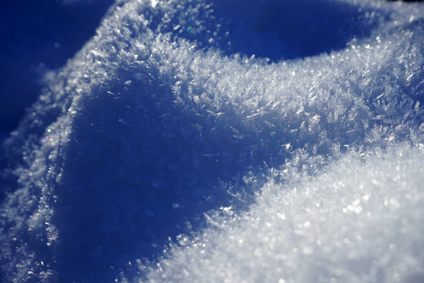 istock Close up of snow with ice crystals 1283947414