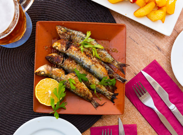 istock Fried sardines with lemon and parsley 1283953410