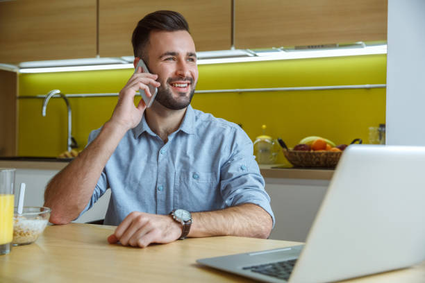 istock Bachelor man daily routine in the kitchen single lifestyle concept phone call 1283955055