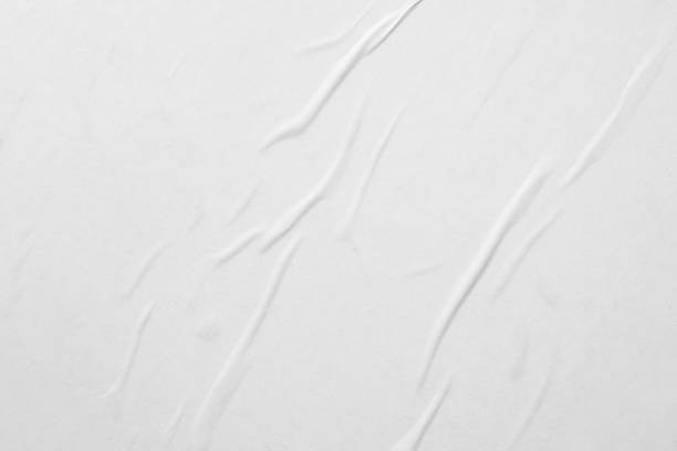 istock Blank white crumpled and creased paper poster texture background 1283955153