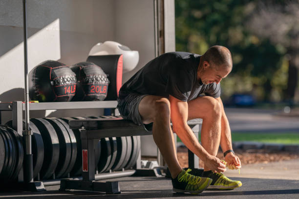 istock Athletic man preparing to do a workout in home gym set up in garage 1283955730