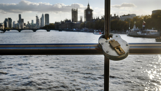 Chained and padlocked gates on the River Thames embankment at Westminster represent the 'Lockdown' of London and the UK during the Covid 19 pandemic