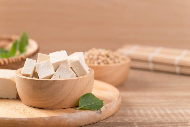 istock Fresh cube tofu and soybean seeds 1283958423