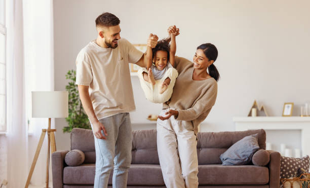 istock Diverse family playing near sofa 1283958458