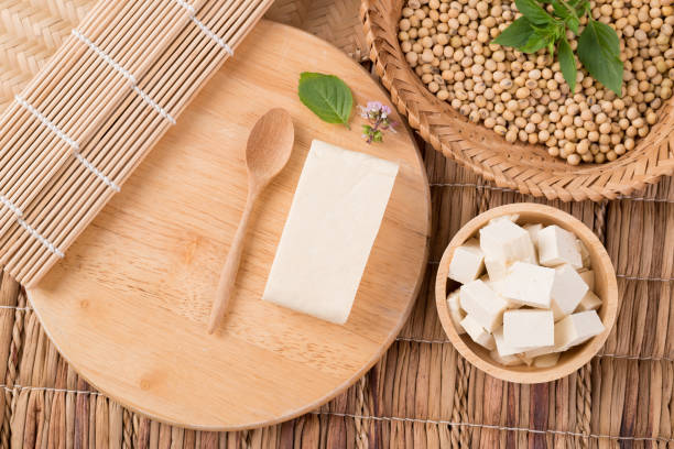 istock Fresh cube tofu and soybean seeds 1283958468