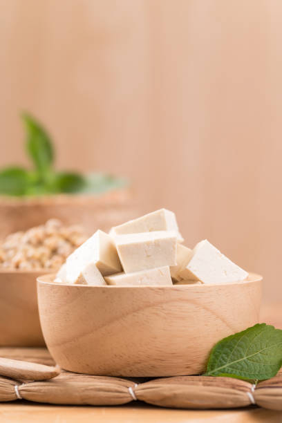 istock Fresh cube tofu and soybean seeds 1283958608