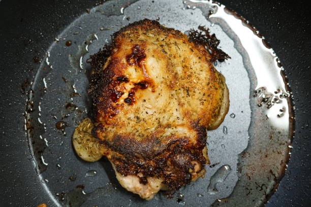 istock Pork fried in a frying pan. At home. 1283959257