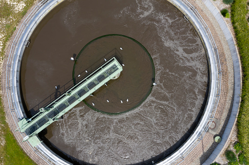 Aerial view of the primary clarifier close-up at the wastewater treatment plant.